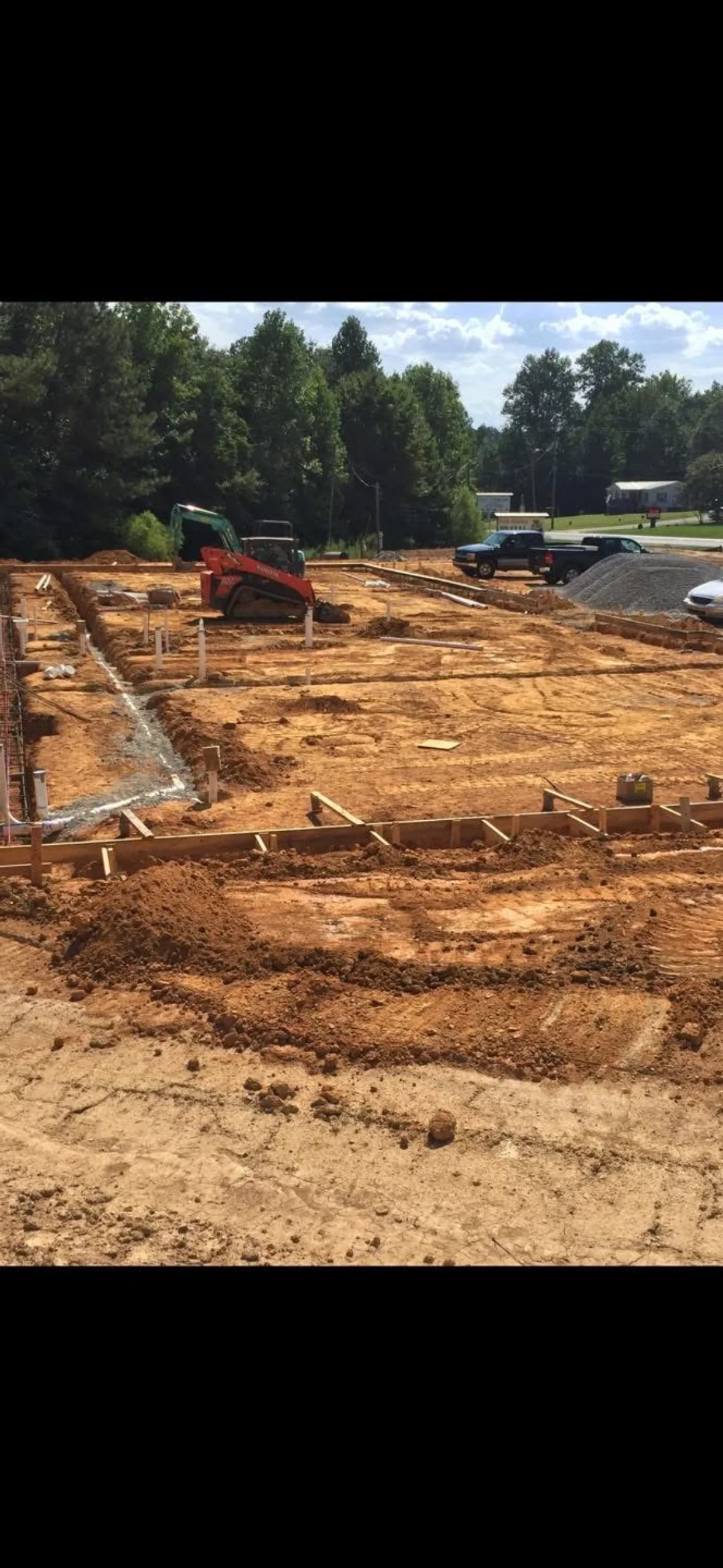 Professional plumber working on residential water line installation