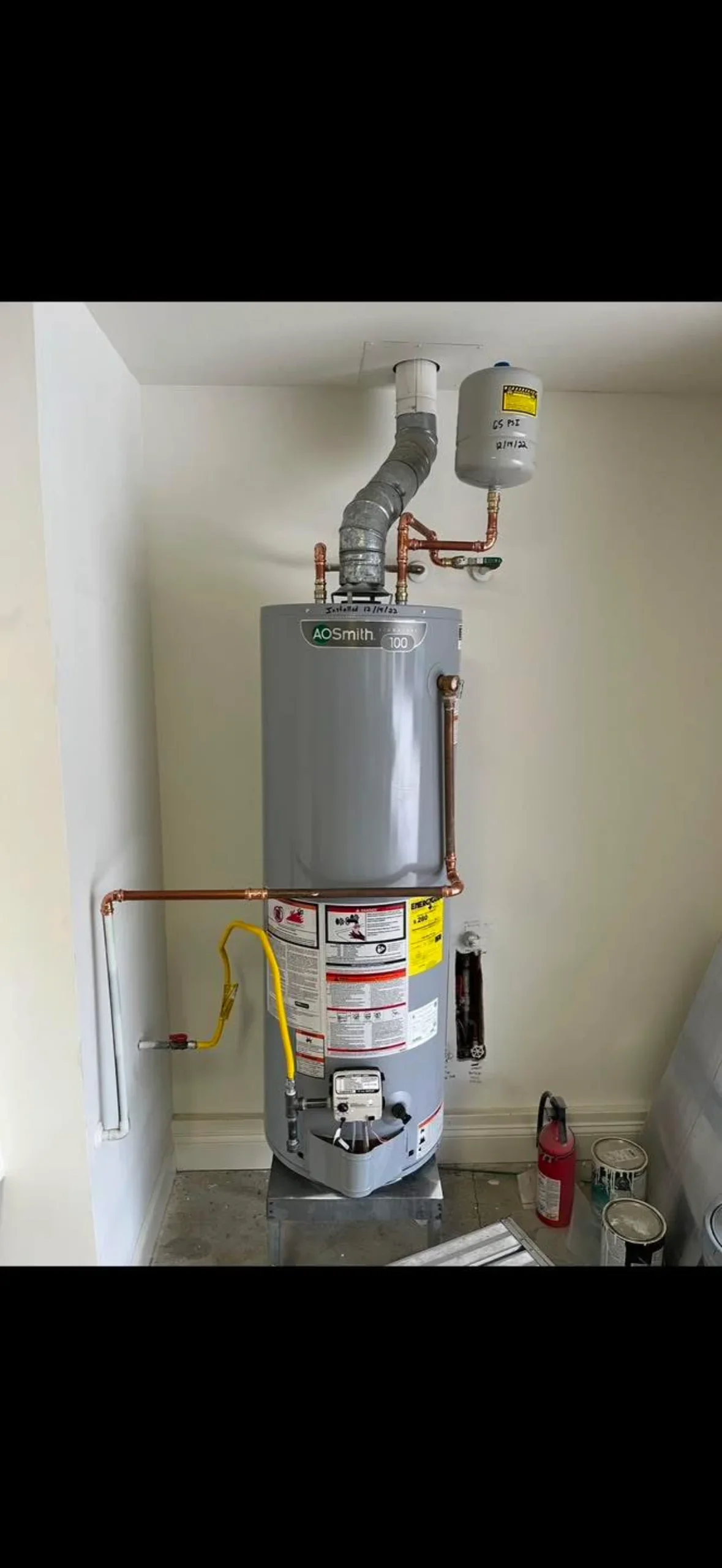 AO Smith water heater with expansion tank, copper piping, and gas line installation
